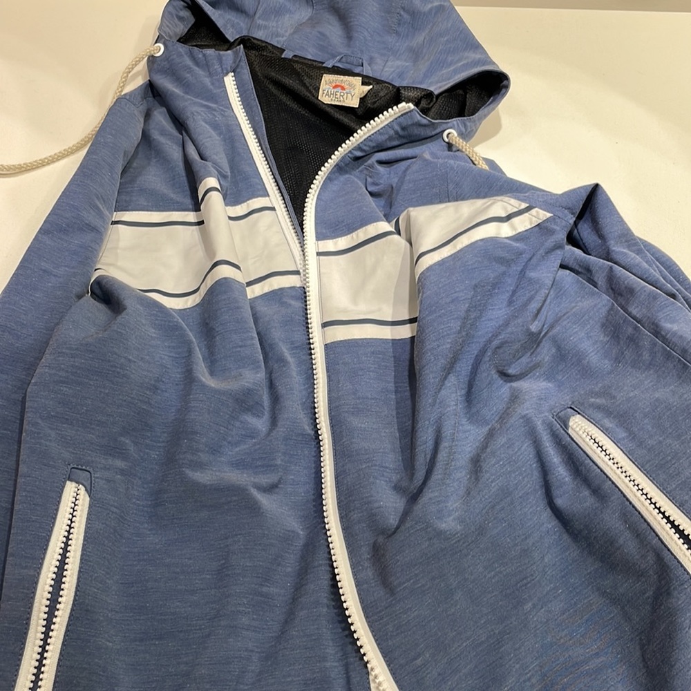 Faherty light rain jacket.  Blue with White vintage stripe. Mesh inlay with hood